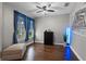 Living room with hardwood flooring, bright window, and modern decor at 3865 W Stillwood Ln, Lake Mary, FL 32746