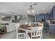Open-concept living space that seamlessly connects the kitchen, dining area, and living room at 3865 W Stillwood Ln, Lake Mary, FL 32746