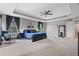 Large main bedroom featuring tray ceilings, carpet floors, and calming colors at 3865 W Stillwood Ln, Lake Mary, FL 32746