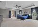 Expansive main bedroom with tray ceilings and en suite bathroom access at 3865 W Stillwood Ln, Lake Mary, FL 32746