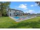 Backyard with a sparkling blue pool, lounge chairs, and lush green lawn at 3865 W Stillwood Ln, Lake Mary, FL 32746