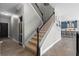 Carpeted staircase with white railings, with view into dining and kitchen space at 3865 W Stillwood Ln, Lake Mary, FL 32746