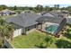 Aerial shot of home with screened pool, fenced yard and well-maintained landscaping at 445 Oakland Park Blvd, Port Orange, FL 32127