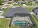 Roof, screened pool enclosure, and yard at 445 Oakland Park Blvd, Port Orange, FL 32127