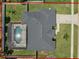 Home sits on a lot with a fenced in backyard, a pool with a screen enclosure, and mature landscaping at 445 Oakland Park Blvd, Port Orange, FL 32127