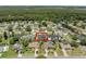 Bird's eye perspective of homes with well-kept yards and pools in a tranquil residential neighborhood setting at 445 Oakland Park Blvd, Port Orange, FL 32127