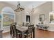 Traditional dining room boasts wood floors, decorative lighting, and adjacent console table at 445 Oakland Park Blvd, Port Orange, FL 32127