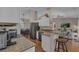 Spacious kitchen with breakfast bar overlooking dining and living spaces for seamless entertaining at 445 Oakland Park Blvd, Port Orange, FL 32127