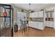 Breakfast nook with white cabinets and stainless appliances with a table and chairs by a window at 445 Oakland Park Blvd, Port Orange, FL 32127