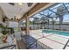Screened pool area featuring outdoor seating and a ceiling fan at 445 Oakland Park Blvd, Port Orange, FL 32127