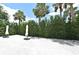 Spacious backyard with white pebble ground cover, offering a low-maintenance outdoor living area at 507 N Peninsula Ave, New Smyrna Beach, FL 32169