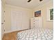Bright bedroom featuring wood floors, neutral walls and a closet at 507 N Peninsula Ave, New Smyrna Beach, FL 32169