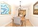 This traditional dining room is open to other living spaces, offering a seamless space for dining and entertaining at 507 N Peninsula Ave, New Smyrna Beach, FL 32169