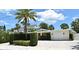 Exterior view of home showcasing a manicured lawn, brick driveway, and an attached one car garage at 507 N Peninsula Ave, New Smyrna Beach, FL 32169