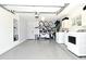 Clean and well-organized garage with epoxy floors, storage, and laundry facilities at 507 N Peninsula Ave, New Smyrna Beach, FL 32169