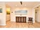 Elegant hallway featuring hardwood floors, stylish artwork, and a decorative sideboard at 507 N Peninsula Ave, New Smyrna Beach, FL 32169