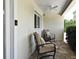 Outdoor patio with comfortable seating, ceiling fan, and views of the surroundings at 507 N Peninsula Ave, New Smyrna Beach, FL 32169