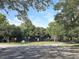 Community basketball court surrounded by lush trees providing ample recreational space at 5262 Lescot Ln, Orlando, FL 32811
