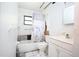 Bathroom featuring a shower-tub combination with nautical-themed shower curtain at 5262 Lescot Ln, Orlando, FL 32811