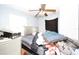 Bedroom with ceiling fan, silver bedframe, and assorted furniture at 5262 Lescot Ln, Orlando, FL 32811