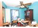 Cluttered bedroom with blue walls and lots of personal items at 5262 Lescot Ln, Orlando, FL 32811
