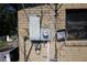Exterior of a house with a damaged electrical box and exposed wires at 5262 Lescot Ln, Orlando, FL 32811