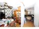A cluttered living room with geometric wallpaper and tile flooring at 5262 Lescot Ln, Orlando, FL 32811