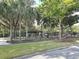 View of playground features covered picnic area, slides, and lush landscaping at 5262 Lescot Ln, Orlando, FL 32811