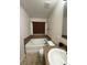 A clean bathroom with a tub, toilet, and vanity with a round sink at 626 Old Pine Ct, Sanford, FL 32773