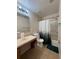 Standard bathroom with a shower-tub combo and a decorative forest-themed shower curtain at 626 Old Pine Ct, Sanford, FL 32773