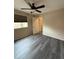 A bedroom with hardwood floors and a ceiling fan and light fixture at 626 Old Pine Ct, Sanford, FL 32773