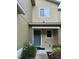 Charming townhome featuring a teal-painted front door at 626 Old Pine Ct, Sanford, FL 32773