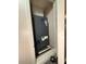 Indoor HVAC unit inside of a small utility closet with white trim and black fixtures at 626 Old Pine Ct, Sanford, FL 32773