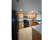 Well-equipped kitchen features stainless steel appliances and ample cabinet space at 626 Old Pine Ct, Sanford, FL 32773