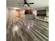 Open-concept living area with wood-look flooring, perfect for entertaining at 626 Old Pine Ct, Sanford, FL 32773
