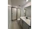 Modern bathroom with a glass-enclosed shower and sleek vanity at 710 Junonia Blvd, New Smyrna Beach, FL 32168