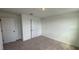 Bedroom features carpeted floors and an interior door to hallway at 710 Junonia Blvd, New Smyrna Beach, FL 32168