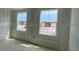 Cozy bedroom featuring two windows, awaiting personalization at 710 Junonia Blvd, New Smyrna Beach, FL 32168