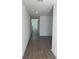 Inviting hallway with sleek, modern flooring leading into other bright rooms at 710 Junonia Blvd, New Smyrna Beach, FL 32168