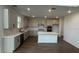 Bright, open kitchen featuring stainless steel appliances, and a large island at 710 Junonia Blvd, New Smyrna Beach, FL 32168