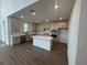 Modern kitchen with stainless appliances, an island, and plenty of cabinet space at 710 Junonia Blvd, New Smyrna Beach, FL 32168