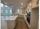 Spacious kitchen with quartz counters, stainless appliances, and an island at 710 Junonia Blvd, New Smyrna Beach, FL 32168
