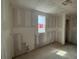 A kitchen under construction featuring smooth drywall, window, and plumbing set-up for new construction and design at 710 Junonia Blvd, New Smyrna Beach, FL 32168