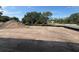 Cleared land with trees in the background at 710 Junonia Blvd, New Smyrna Beach, FL 32168