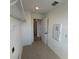 Functional laundry room with tile flooring and shelving at 710 Junonia Blvd, New Smyrna Beach, FL 32168