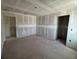 Large living room features doorways into other areas of the house at 710 Junonia Blvd, New Smyrna Beach, FL 32168