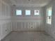 Large living room features multiple windows with natural light at 710 Junonia Blvd, New Smyrna Beach, FL 32168