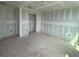 Large living room showing entryway into other areas of the house at 710 Junonia Blvd, New Smyrna Beach, FL 32168