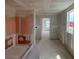 An unfinished room under construction featuring smooth drywall, with a passageway into another part of the home at 710 Junonia Blvd, New Smyrna Beach, FL 32168