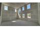 Spacious room under construction with ample natural light and a high ceiling, ready to be personalized at 710 Junonia Blvd, New Smyrna Beach, FL 32168